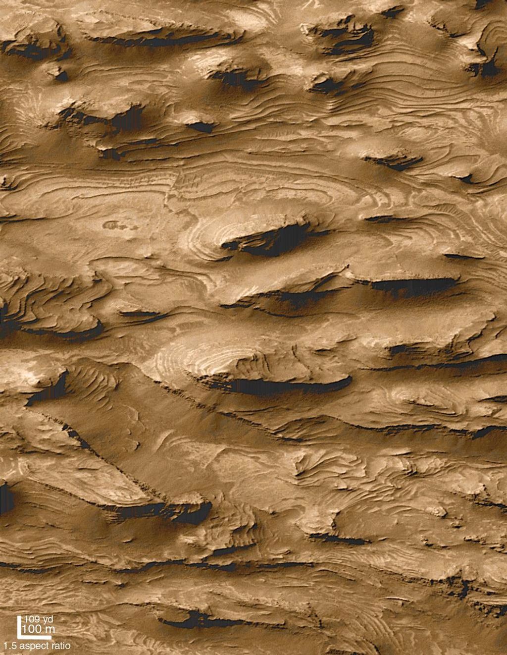 NASA's Mars Global Surveyor shows layered outcrops of far west Candor Chasma on Mars.