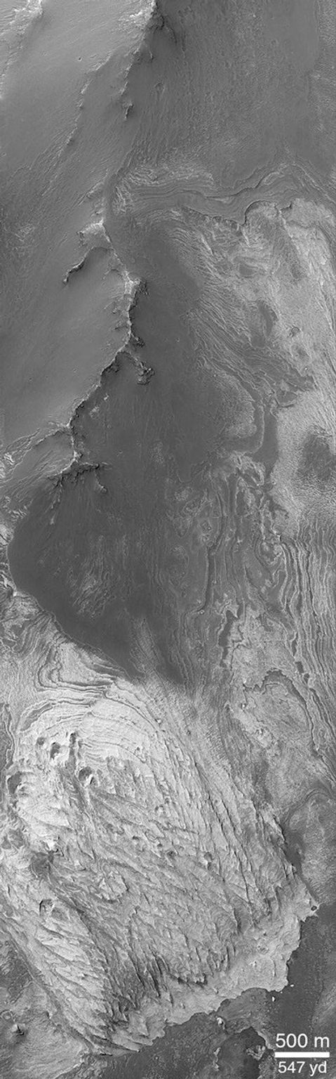 NASA's Mars Global Surveyor shows Valles Marineris, a system of troughs, chasms, and pit chains that stretches more than 4,000 km (2,500 miles) across the martian western hemisphere.