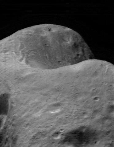This image of asteroid Eros, taken by NASA's NEAR Shoemaker on March 22, 2000, shows the saddle region, a low ridge connecting two mountains.