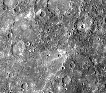 This double ring basin (top center of image) was photographed during NASA's Mariner 10's second encounter and shows two craters about 30 km in diameter which have been engulfed by smooth plains on the floor of the inner ring.