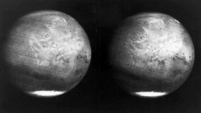 This image from NASA's Mariner 7 shows NIX Olympia (later identified as the giant shield volcano Olympus Mons), and polar caps on Mars.