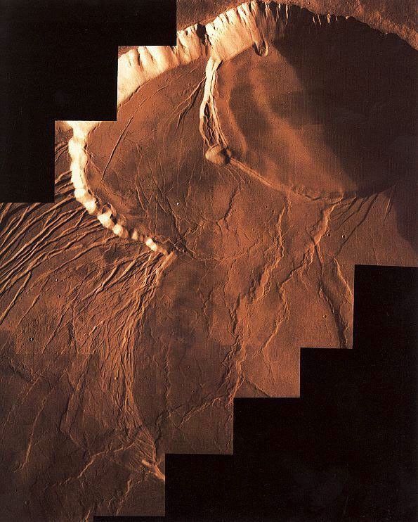 NASA's Viking Orbiter 1 photomosaic of Olympus Mons summit caldera. The caldera comprises a series of craters formed by repeated collapses after eruptions.