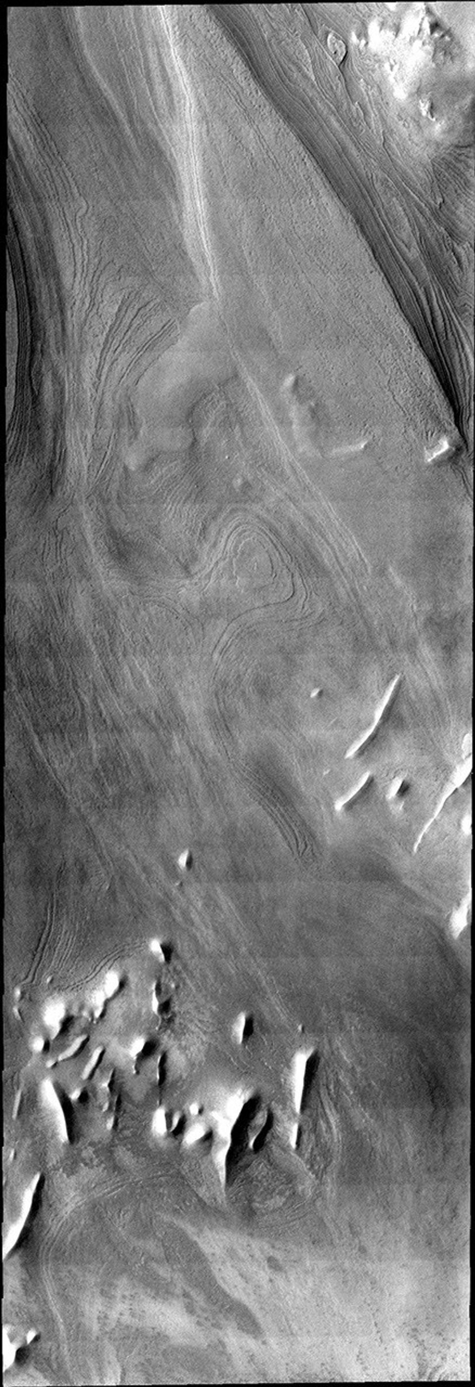 This image illlustrates how distinct polar layers appear with no frost cover. This image was collected during the height of summer at the south pole of Mars by NASA's 2001 Mars Odyssey spacecraft.