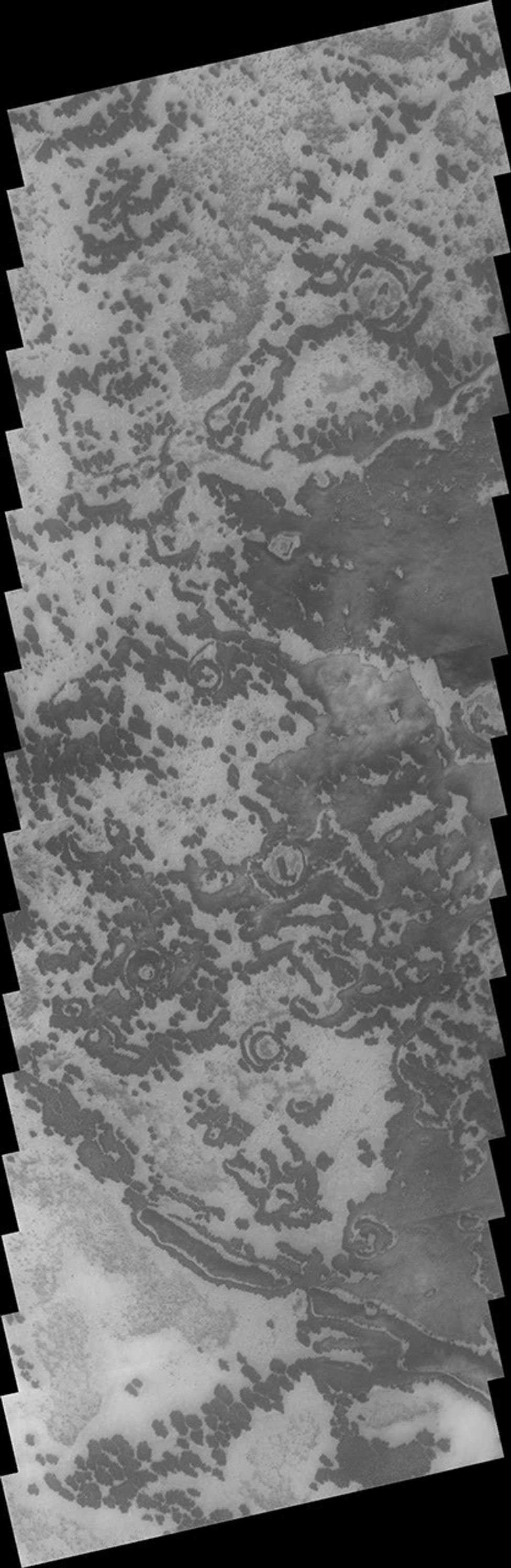 This image from NASA's 2001 Mars Odyssey spacecraft of the south polar region on Mars was collected during the summer season. The markings of the pole are very diverse and easy to see after the winter frost has been removed.
