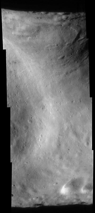This image of asteroid Eros, taken by NASA's NEAR Shoemaker on Sept. 9, 2000, shows Eros' saddle, and curving around at upper right is the large bright-and-dark groove.