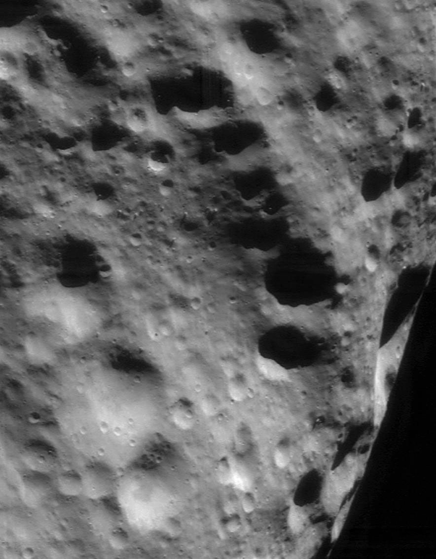 This image of asteroid Eros, taken by NASA's NEAR Shoemaker on Sept.21, 2000, shows a ridge that trends from upper left to lower right is among the older features on Eros, as evidenced by the large number of superimposed impact craters.