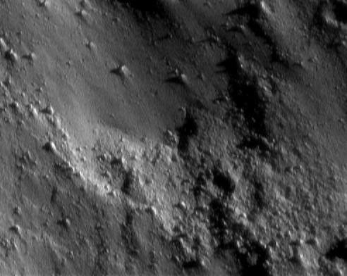 This image of asteroid Eros, taken by NASA's NEAR Shoemaker on Jan. 25, 2001, shows a surface nearly devoid of obvious craters and instead dominated by small boulders.