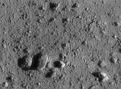 This image of asteroid 433 Eros, taken by NASA's NEAR Shoemaker shows a large, oblong rock casting a big shadow measures 7.4 meters (24 feet) across.