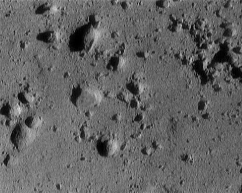 This image of asteroid 433 Eros, taken by NASA's NEAR Shoemaker shows a cluster of rocks at the upper right measuring 1.4 meters (5 feet) across.