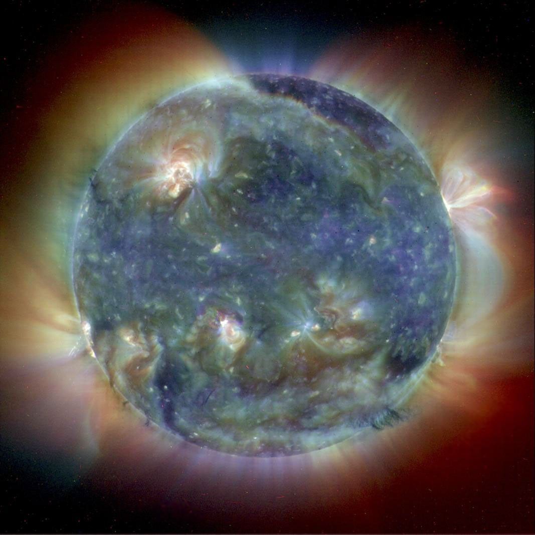 This composite image combines NASA's Extreme Ultravoilet Imaging Telescope images from three wavelengths into one that reveals solar features unique to each wavelength.
