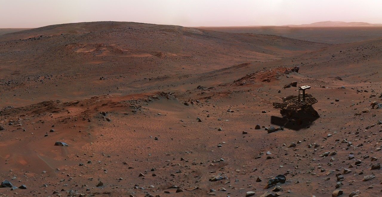 This synthetic image of NASA's Spirit Mars Exploration Rover on the flank of 'Husband Hill' was produced using 'Virtual Presence in Space' technology.