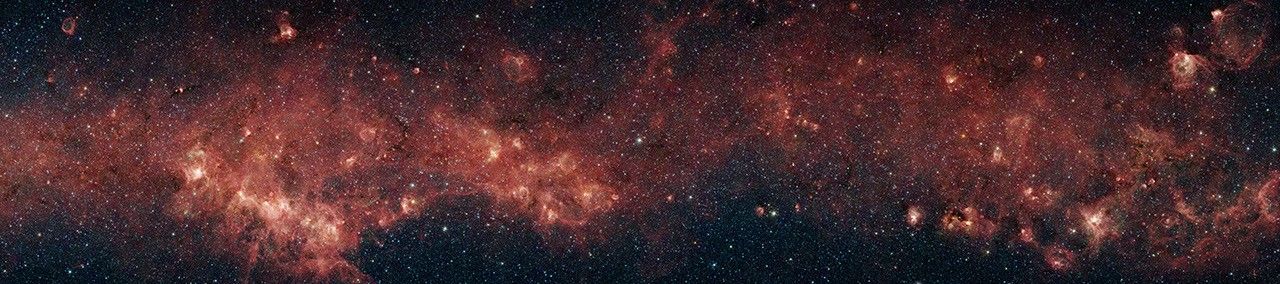 In visible light, the bulk of our Milky Way galaxy's stars are eclipsed behind thick clouds of galactic dust and gas. But to the infrared eyes of NASA's Spitzer Space Telescope, distant stars and dust clouds shine with unparalleled clarity and color.