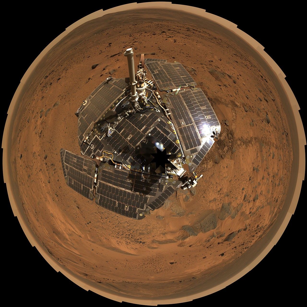 This self-portrait of NASA's Mars Exploration Rover Spirit taken in Aug 27, 2005 shows its solar panels still gleaming in Martian sunlight and carrying only a thin veneer of dust two years after the rover landed and began exploring the red planet.