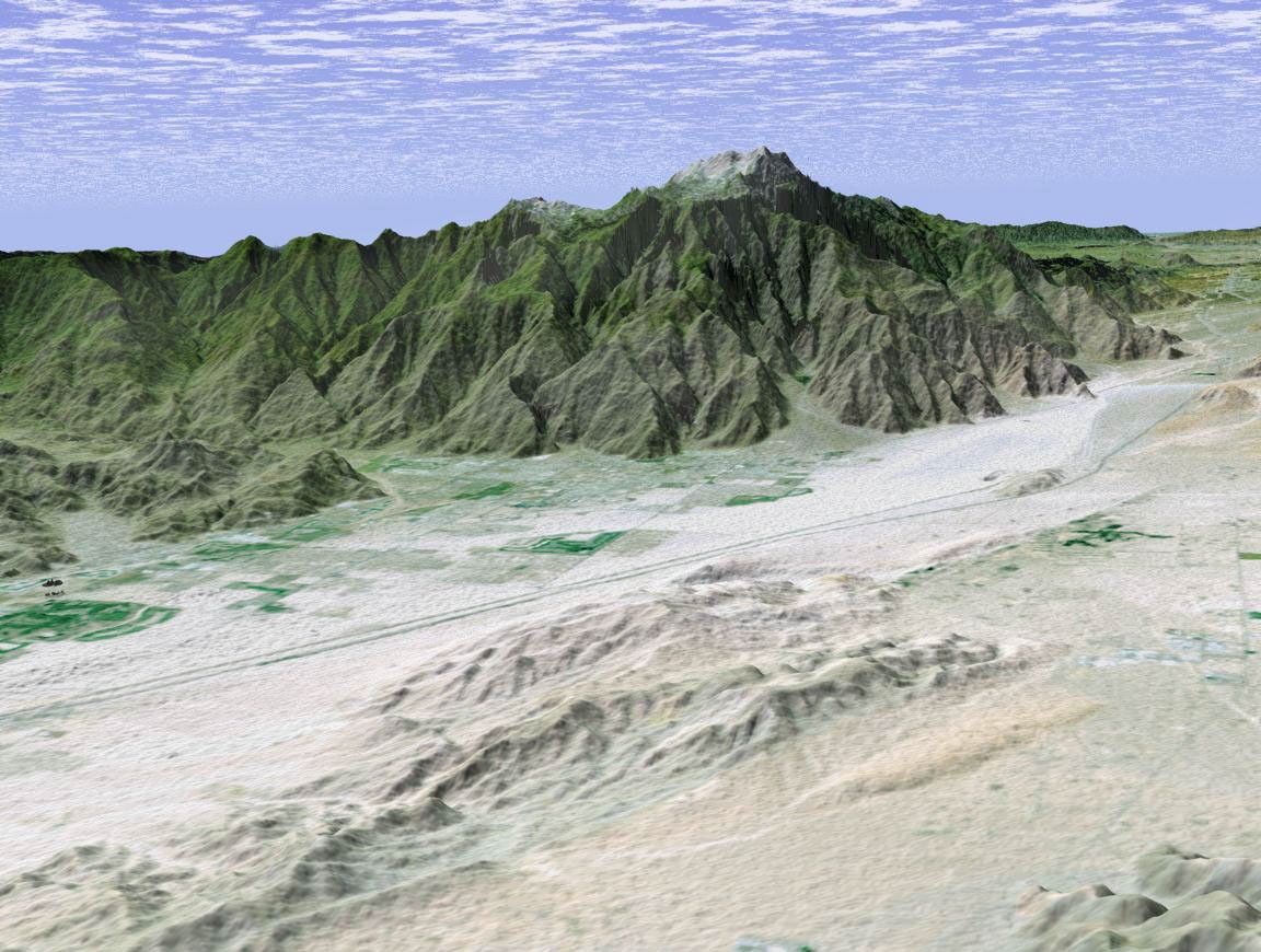 The city of Palm Springs, California nestles at the base of Mount San Jacinto in this computer-generated perspective viewed from the east by from NASA's Shuttle Radar Topography Mission.
