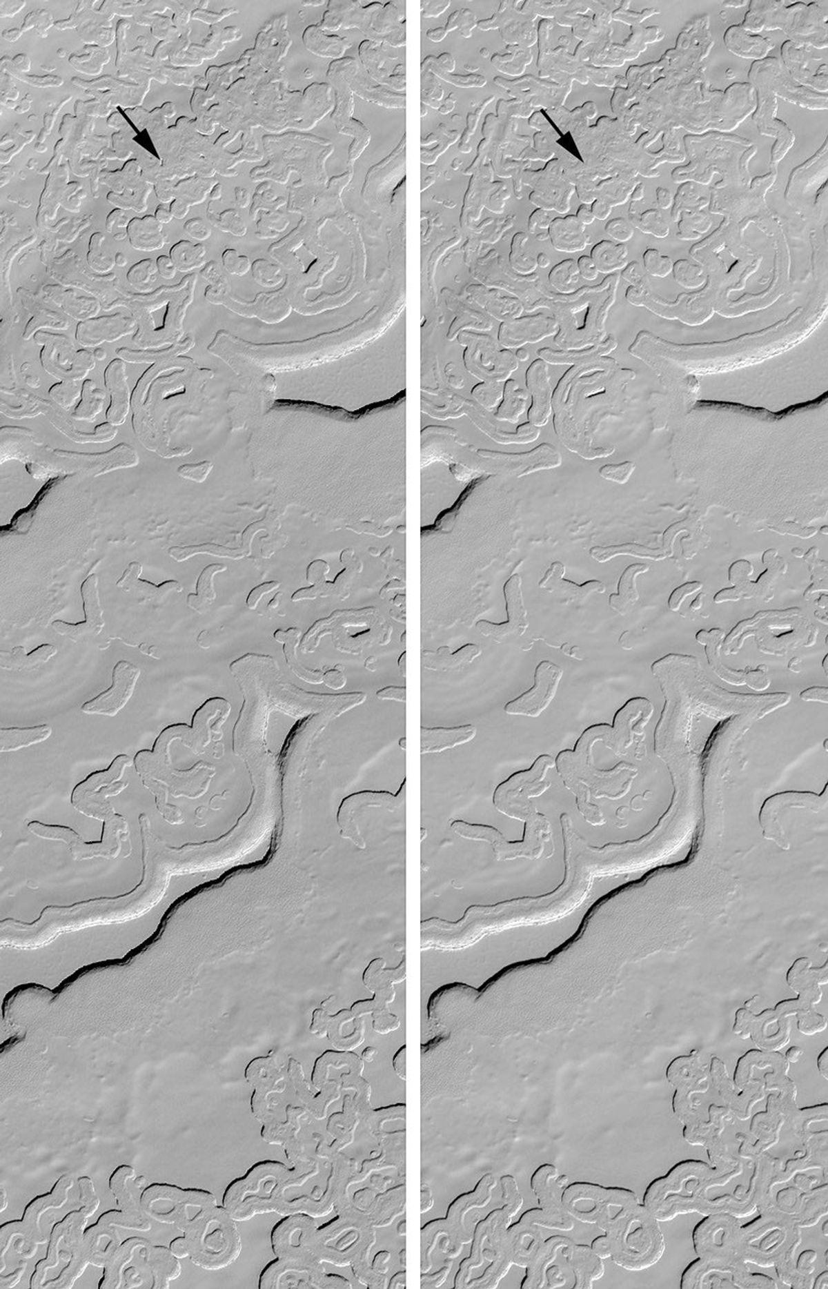 NASA's Mars Global Surveyor shows Mars' south polar cap exhibits an array of bizarre layers, arcuate scarps, and 'swiss cheese' holes and pits.