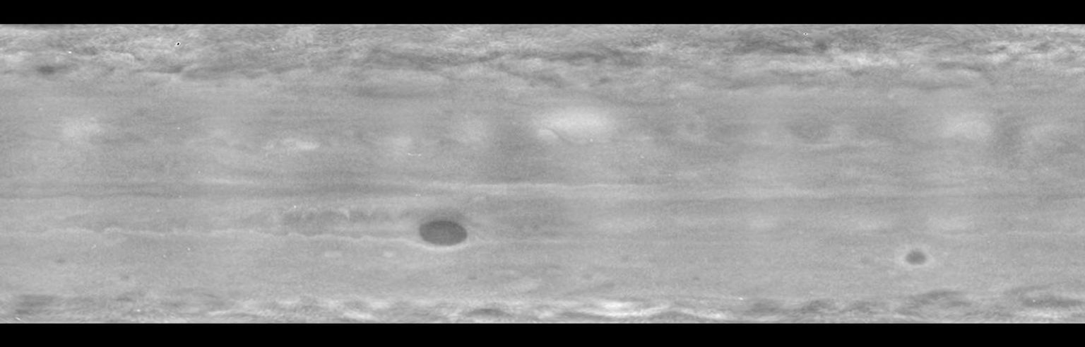 Wave patterns at high latitudes, plus the famous Great Red Spot, dominate a cylindrical map of Jupiter as observed by NASA's Cassini spacecraft in the ultraviolet region of the light spectrum.