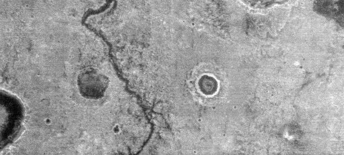 This nighttime thermal infrared image, taken by NASA's Mars Odyssey spacecraft, shows differences in temperature that are due to differences in the abundance of rocks, sand and dust on the surface.