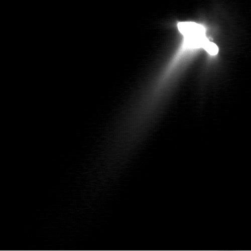 This very long exposure was taken by NASA's Deep Space 1 to show detailed structures in the faint parts of comet Borrelly's inner coma. As a result, the nucleus has been greatly over-exposed and its shape appears distorted.