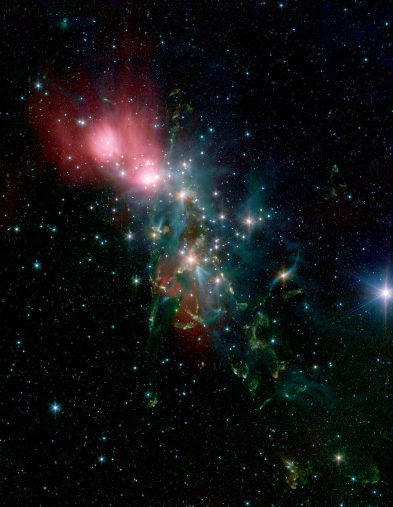 Located 1,000 light years from Earth in the constellation Perseus, a reflection nebula called NGC 1333 epitomizes the beautiful chaos of a dense group of stars being born. This image is from NASA's Spitzer Space Telescope.