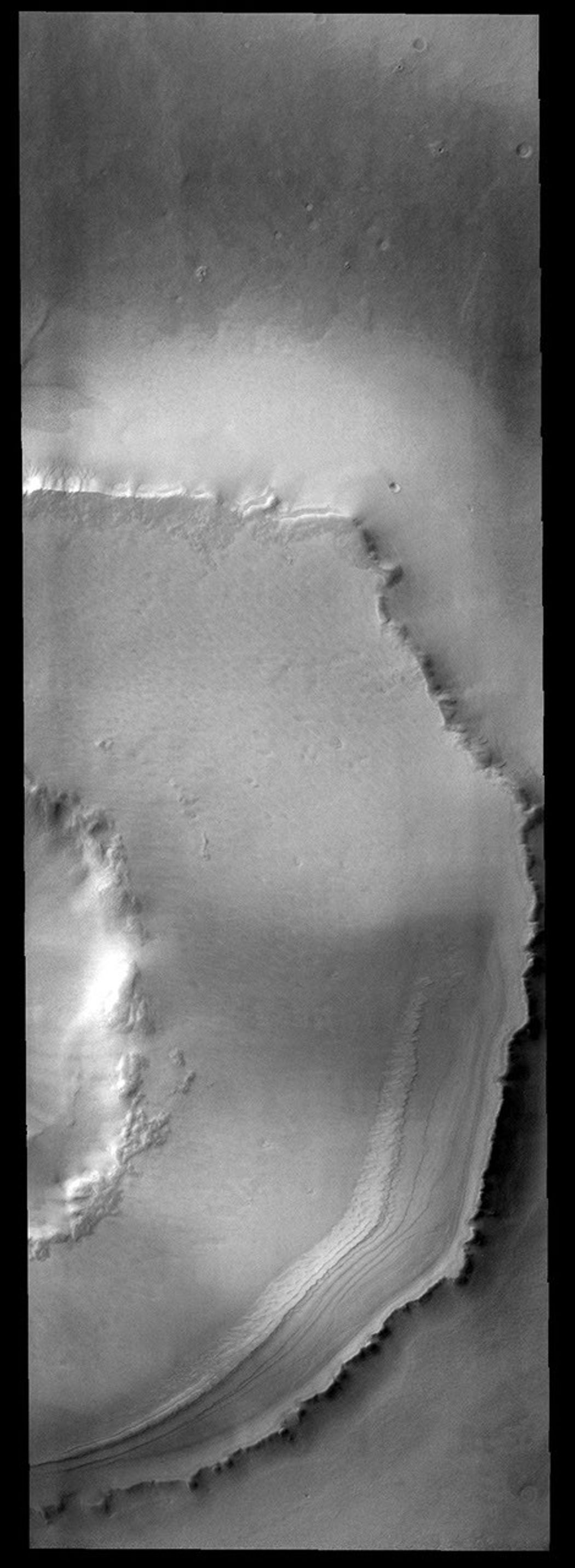 This crater on Mars is located south of Agassiz Crater. It is likely that the polar freeze/thaw/frost cycle is responsible for unusual appearance of the ejecta region around the crater as seen by NASA's 2001 Mars Odyssey spacecraft.