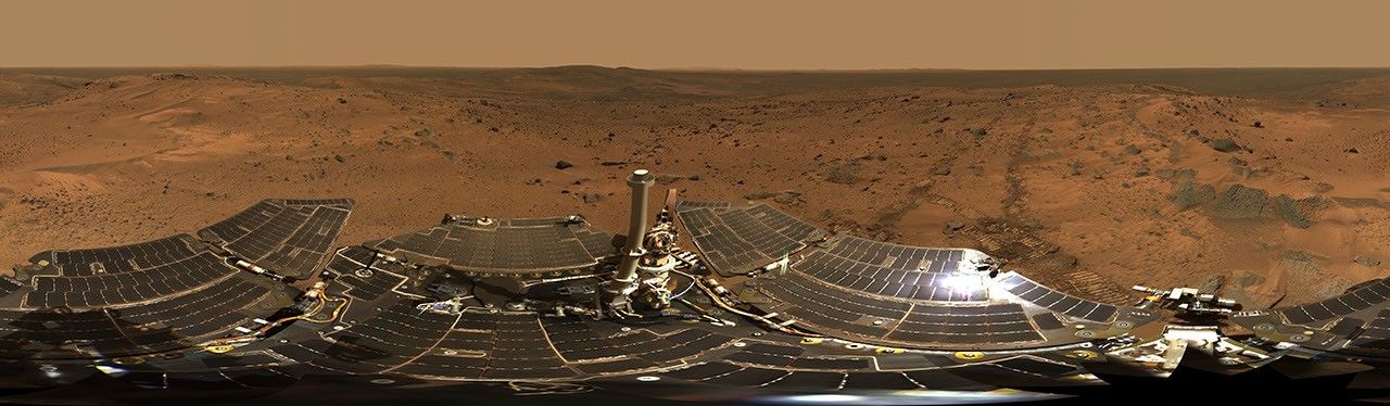 NASA's Mars Exploration Rover Spirit took the hundreds of images during Aug. 24 to 27, 2005 and combined them into this 360-degree view of 'Husband Hill Summit.' Spirit can be seen on Mar's red surface rocks and soils.