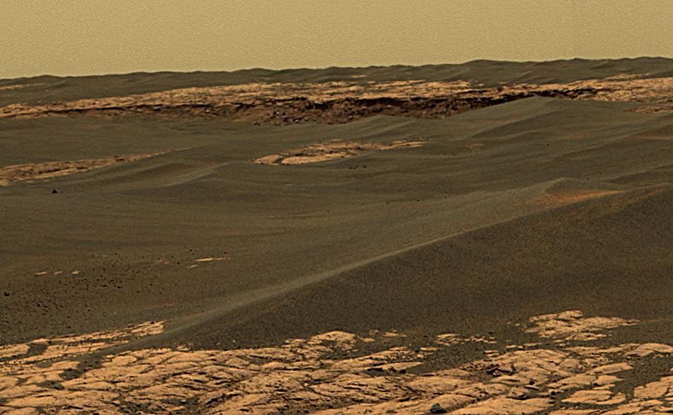 The center upper portion of this image shows a portion of the rim of 'Erebus Crater' in the Meridiani Planum region of Mars. This approximately true-color view from NASA's Mars Exploration Rover Opportunity was acquired on Nov. 28, 2005.
