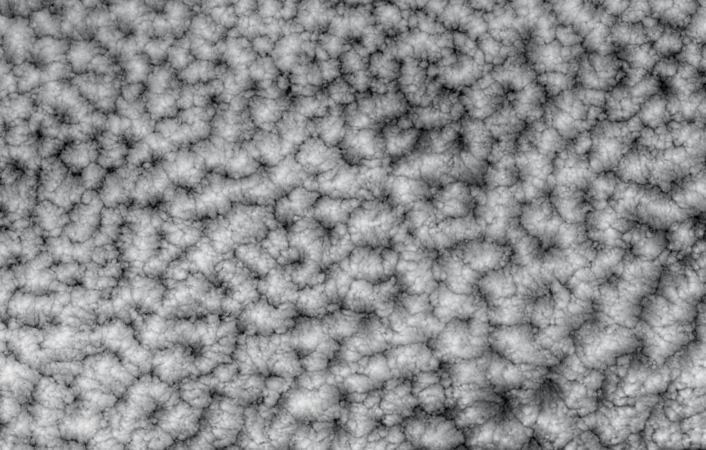 The structure of tightly packed 'closed cells' in a layer of marine stratocumulus over the southeastern Pacific Ocean are highlighted in these views from NASA's Terra satellite.