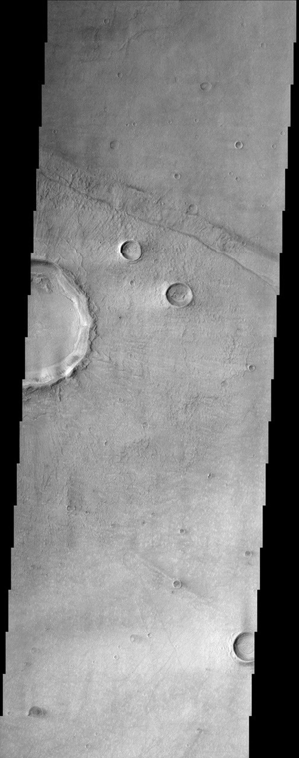 Bosporus Planum, seen in this image from NASA's Mars Odyssey spacecraft, is located in a region of smooth plains that appear to have formed from lava flows.