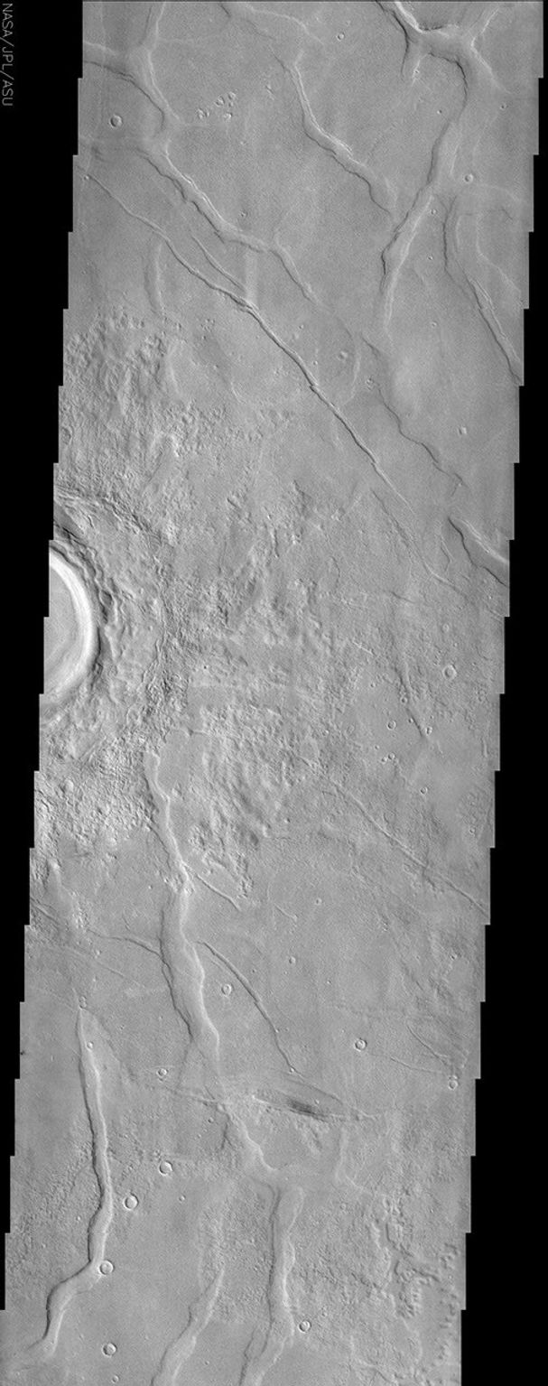 This image by NASA's Mars Odyssey spacecraft shows Utopia Planitia, a large plain in the northern hemisphere of Mars. It is believed that this basin is the result of a large impact.