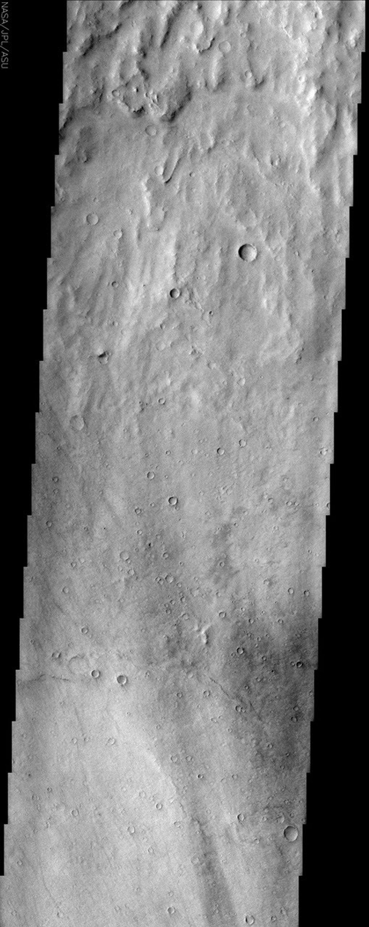 This NASA Mars Odyssey image shows a close-up view of the ridged plains in Hesperia Planum, a classic locality for Martian surfaces that formed in the 'middle ages' of the planet's history.