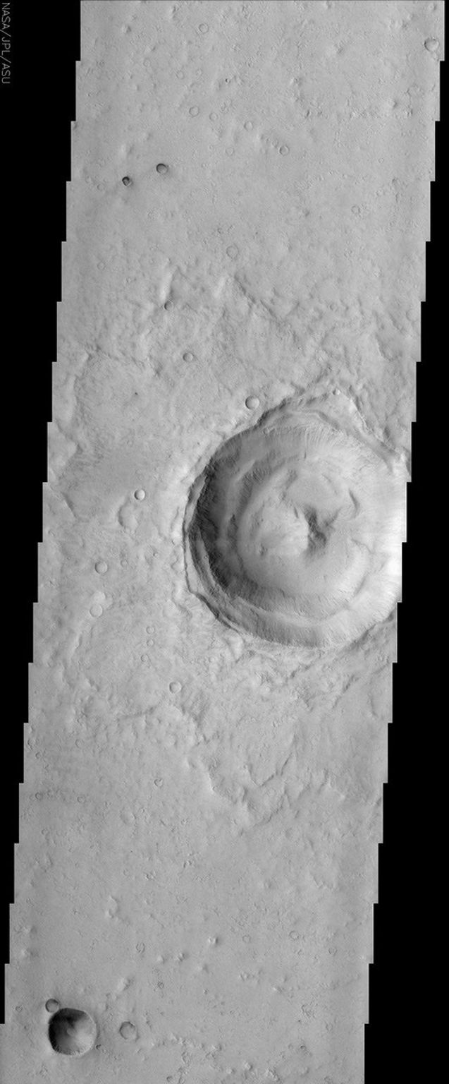 This image taken by NASA's Mars Odyssey spacecraft shows a classic example of a Martian impact crater with a central peak. Central peaks are common in large, fresh craters on both Mars and the Moon.