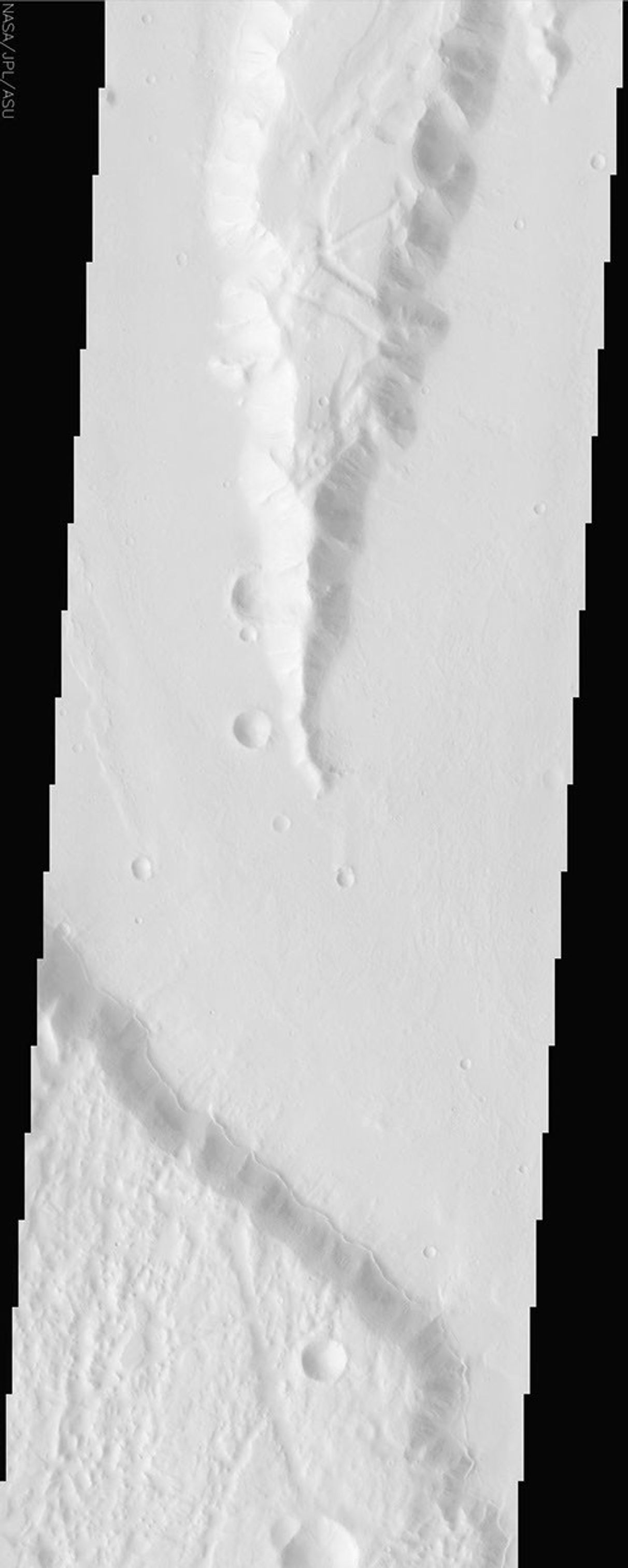 This image by NASA's Mars Odyssey spacecraft is within a region called Lunae Planum, west of NASA's Viking 1 landing site, that marks the transition between the Tharsis rise, a giant volcanic complex, and the northern lowland plains.