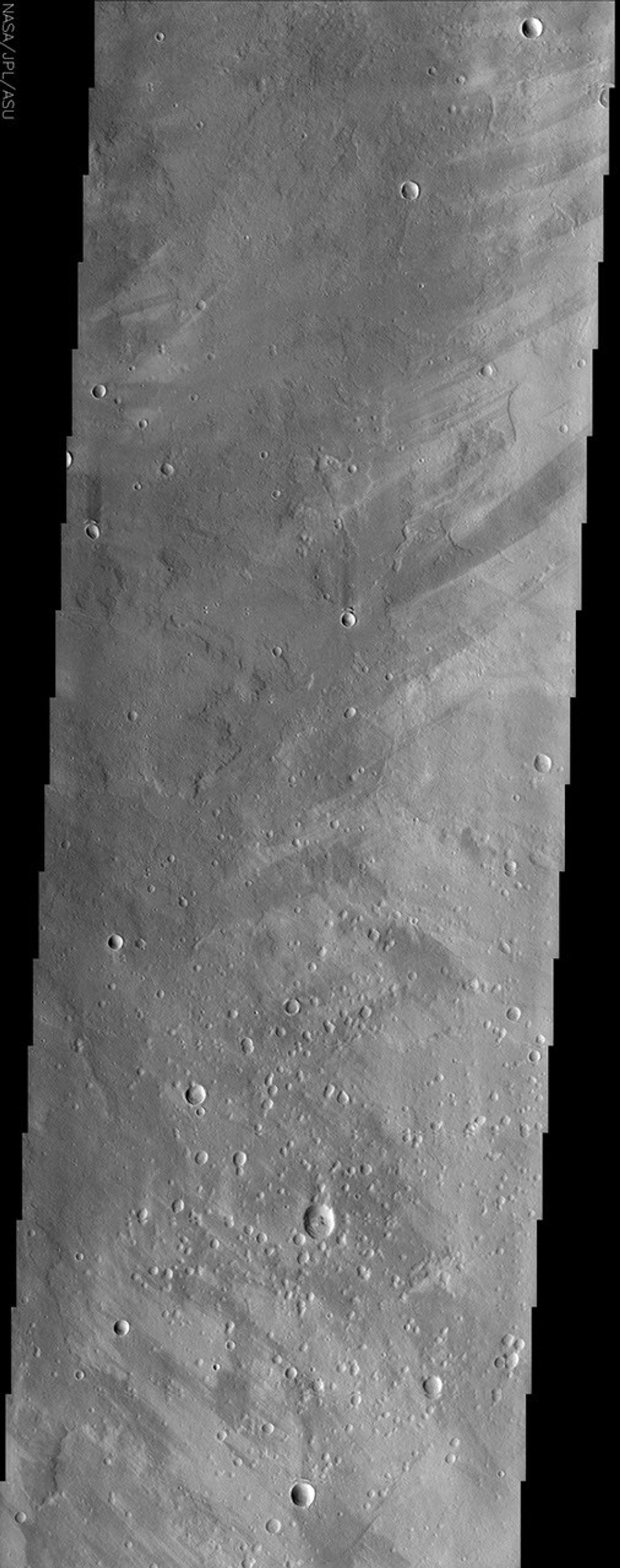 This image from NASA's Mars Odyssey spacecraft shows a region of Mars called Ophir Planum. The Valles Marineris system of canyons that stretch for thousands of kilometers across Mars are located just south of the area covered in the image.