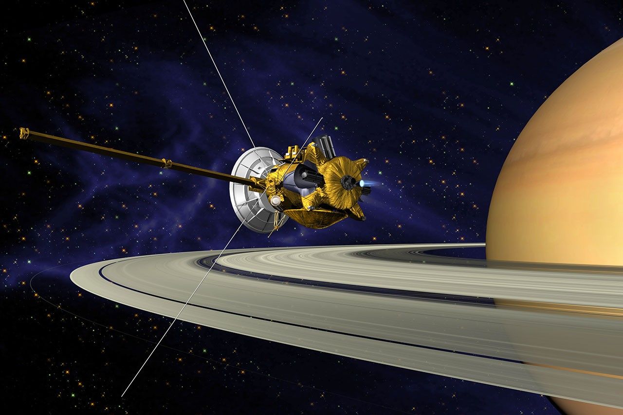 This is an artists concept of NASA's Cassini spacecraft during the Saturn Orbit Insertion (SOI) maneuver, just after the main engine has begun firing.