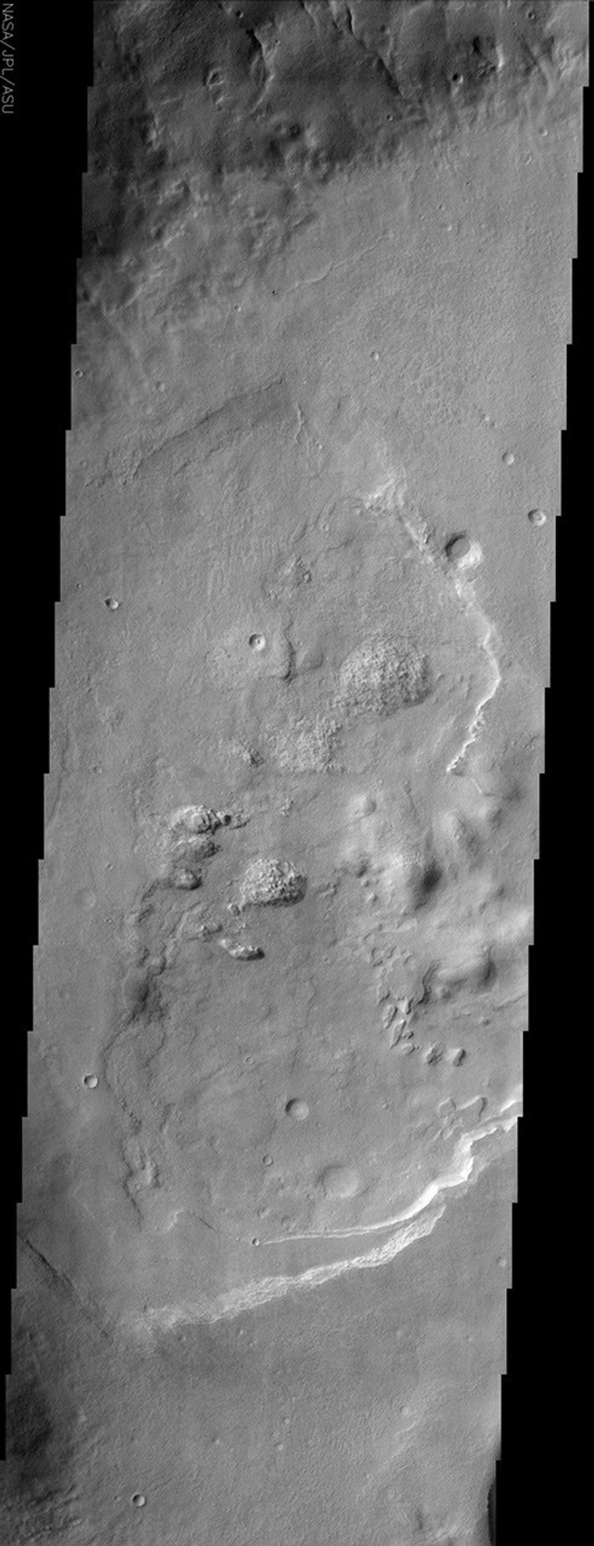 Lineations (fissures, or cracks in the ground) can be seen in this image of Acidalia Planitia from NASA's Mars Odyssey spacecraft and create what is referred to as 'patterned ground' or 'polygonal terrain.'