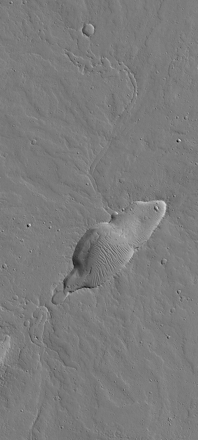 NASA's Mars Global Surveyor shows a small, dust-covered, volcano in the Jovis Fossae region of Mars, known for its extremely large volcanoes, such as Olympus Mons. Many small volcanoes also occur on the red planet, particularly in the Tharsis region.