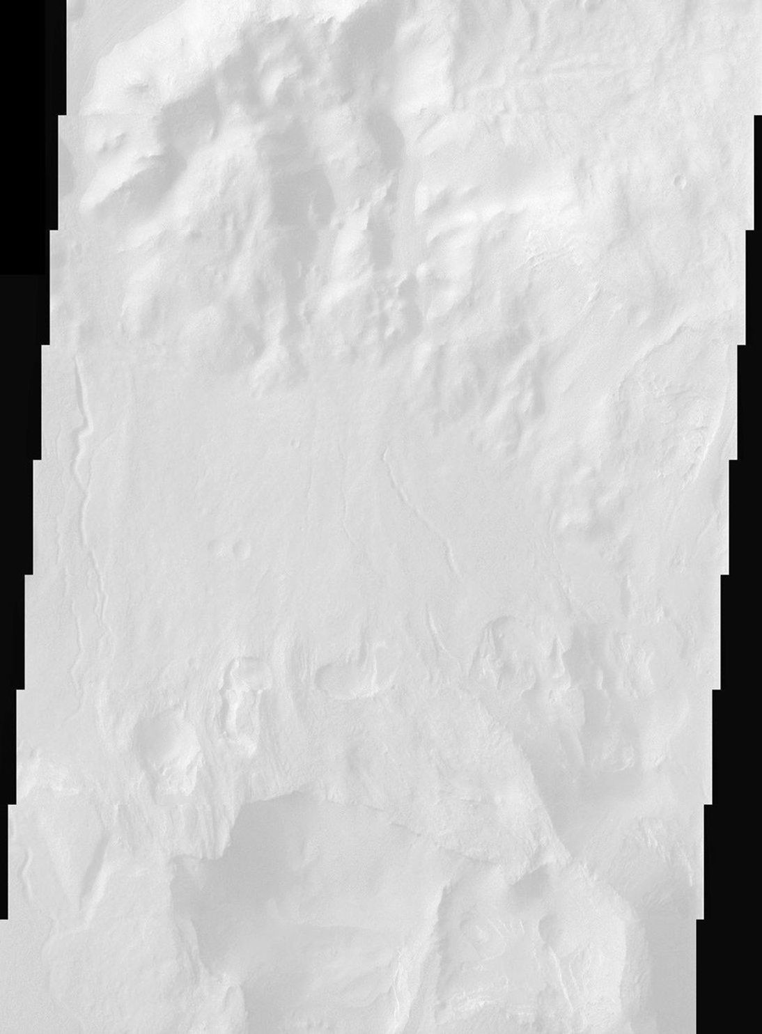 Perched on the northern rim of the enormous Hellas Basin, Terby Crater, imaged by NASA Mars Odyssey, is host to an impressive range of landforms. As is common for many Martian craters, Terby has been filled with layered material, presumably sediments.