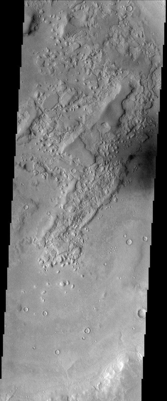 This image from NASA's Mars Odyssey spacecraft shows a location within Semeykin Crater, which is in the Martian northern hemisphere.