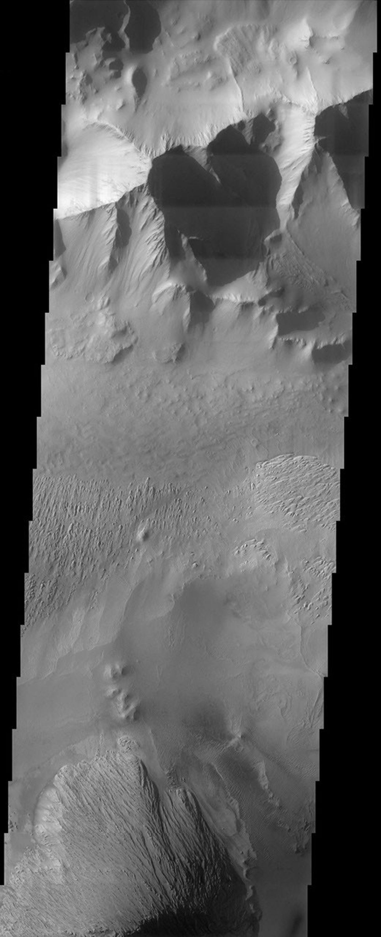 This image from NASA's Mars Odyssey spacecraft covers part of Tithonium Chasma, which is part of the Valles Marineris system of canyons that stretch for thousands of kilometers.