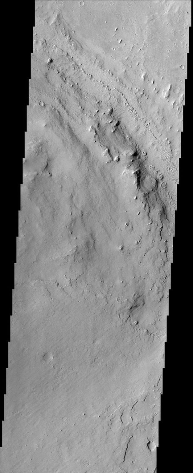 Located in Arabia Terra, the crater shown in this image from NASA's Mars Odyssey spacecraft is known as Henry Crater. Like many other craters on Mars, the interior of Henry Crater is filled with a layered deposit.