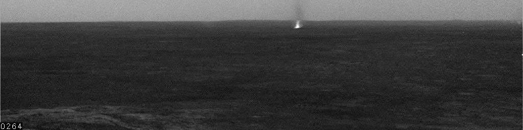 One dust devil scoots across the center of the view showing a few dust devils inside Mars' Gusev Crater. The image was taken by the navigation camera on NASA's Mars Exploration Rover Spirit during the rover's 543rd martian day, or sol (July 13, 2005).