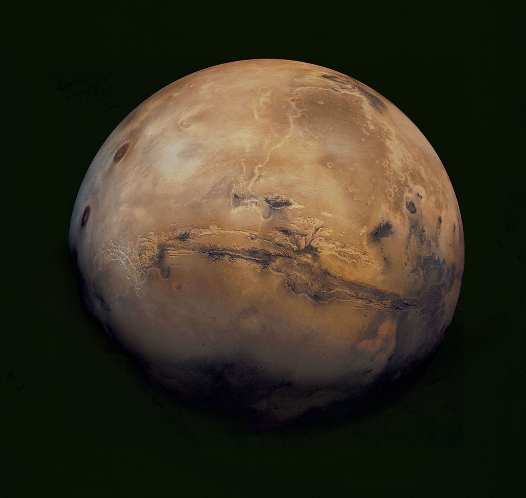 This mosaic of Mars is a compilation of images captured by NASA's Viking Orbiter 1. The center of the scene shows the entire Valles Marineris canyon system, over 3,000 km long and up to 8 km deep, extending from Noctis Labyrinthus.