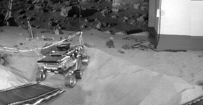 'Marie Curie' rover drives down the rear ramp during Operational Readiness Test (ORT) 4. NASA's Pathfinder, a low-cost Discovery mission, is the first of a new fleet of spacecraft that are planned to explore Mars.