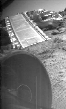 During a soil mechanics experiment, NASA's Mars Pathfinder rover Sojourner does a wheelie, lifting its front left wheel into the air.