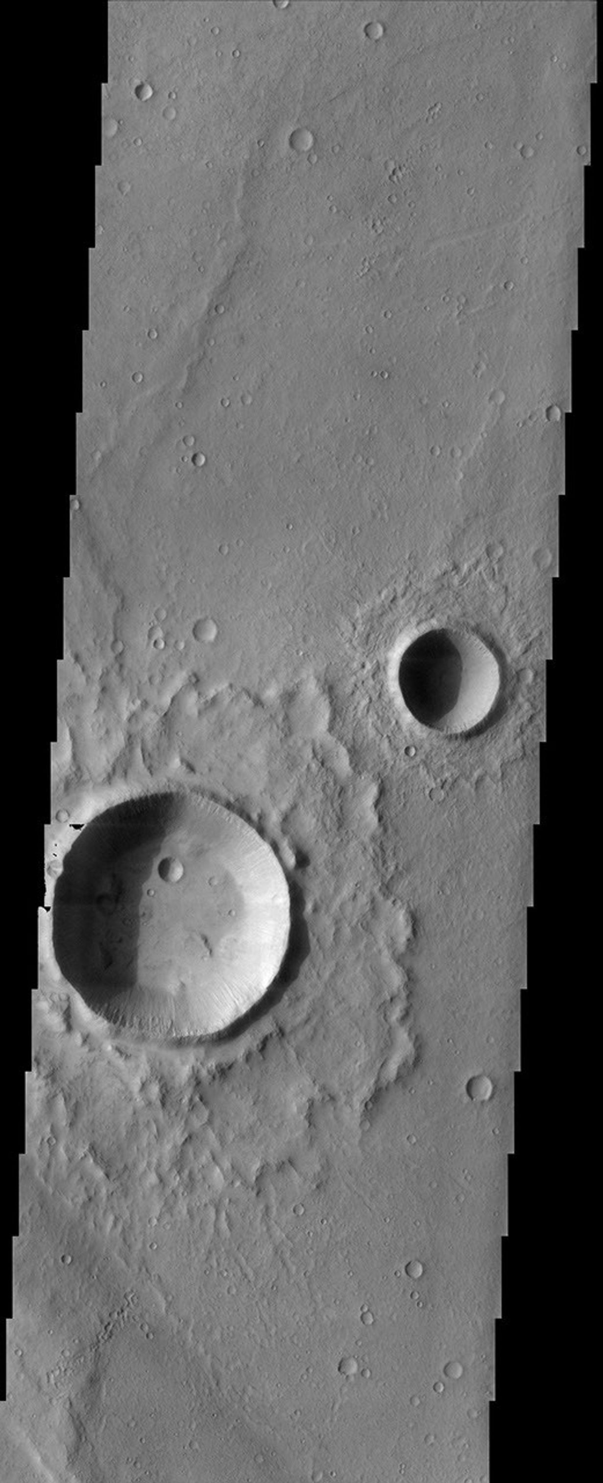 The fluidized impact crater ejecta and flat crater floors observed in this image from NASA's Mars Odyssey spacecraft suggest near-surface volatiles once played an important role in modifying the Martian surface.