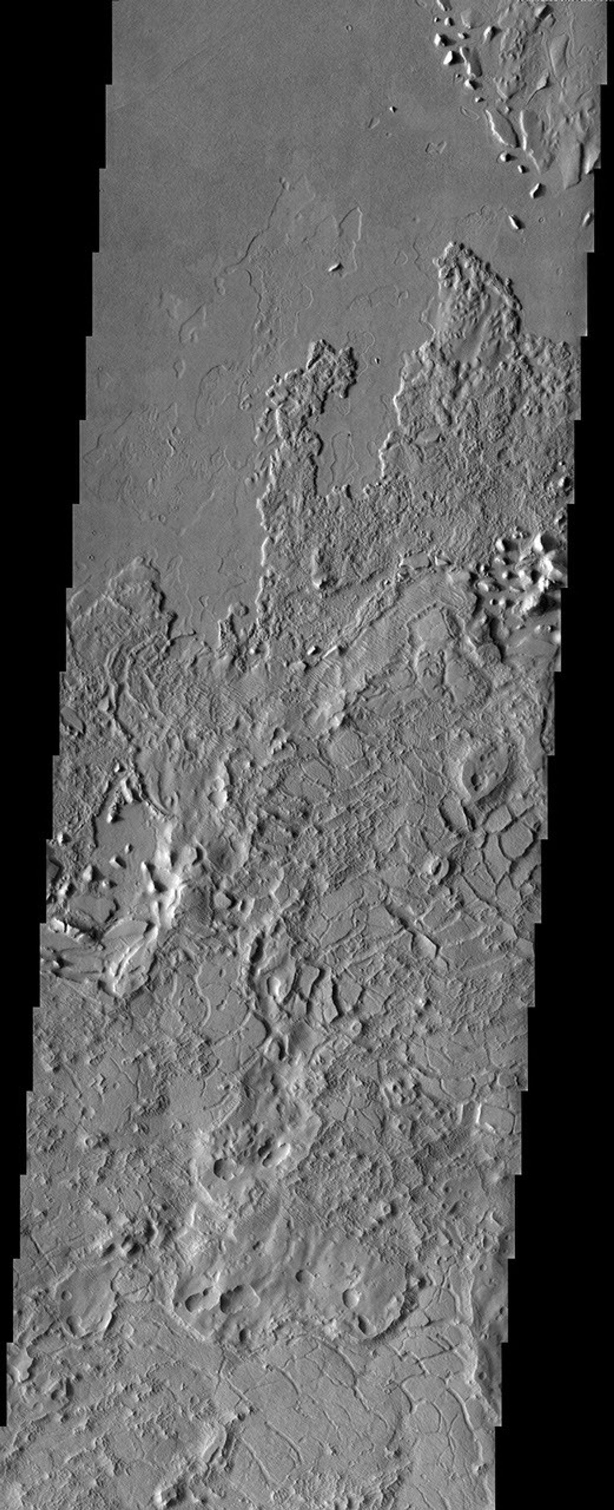 This image from NASA's Mars Odyssey spacecraft shows a crazy mixture of bizarre surface features in Lucus Planum.