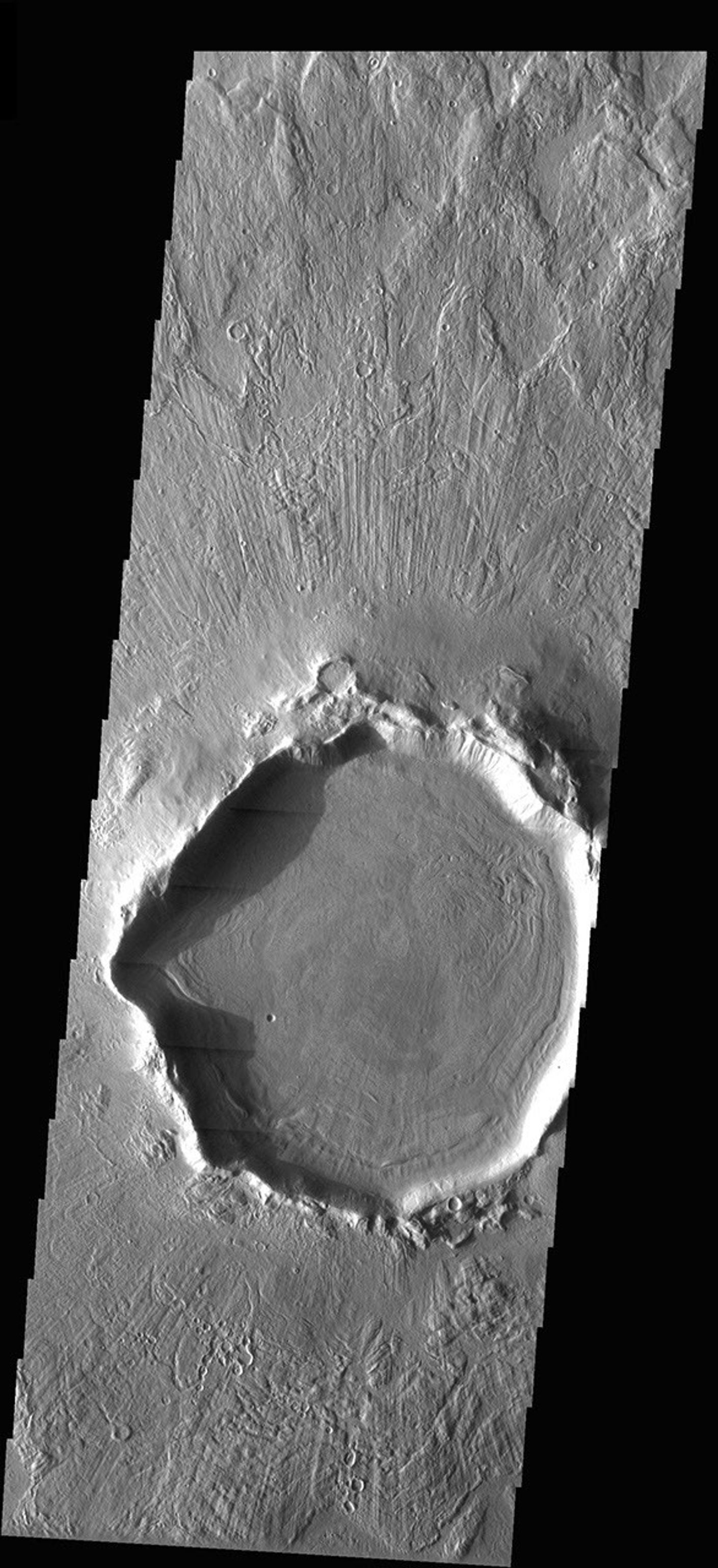 This crater on Mars is located at 37°N, a latitude far enough north that ground ice is present, and it sculpts the terrain when it moves. This image is from NASA's Mars Odyssey.