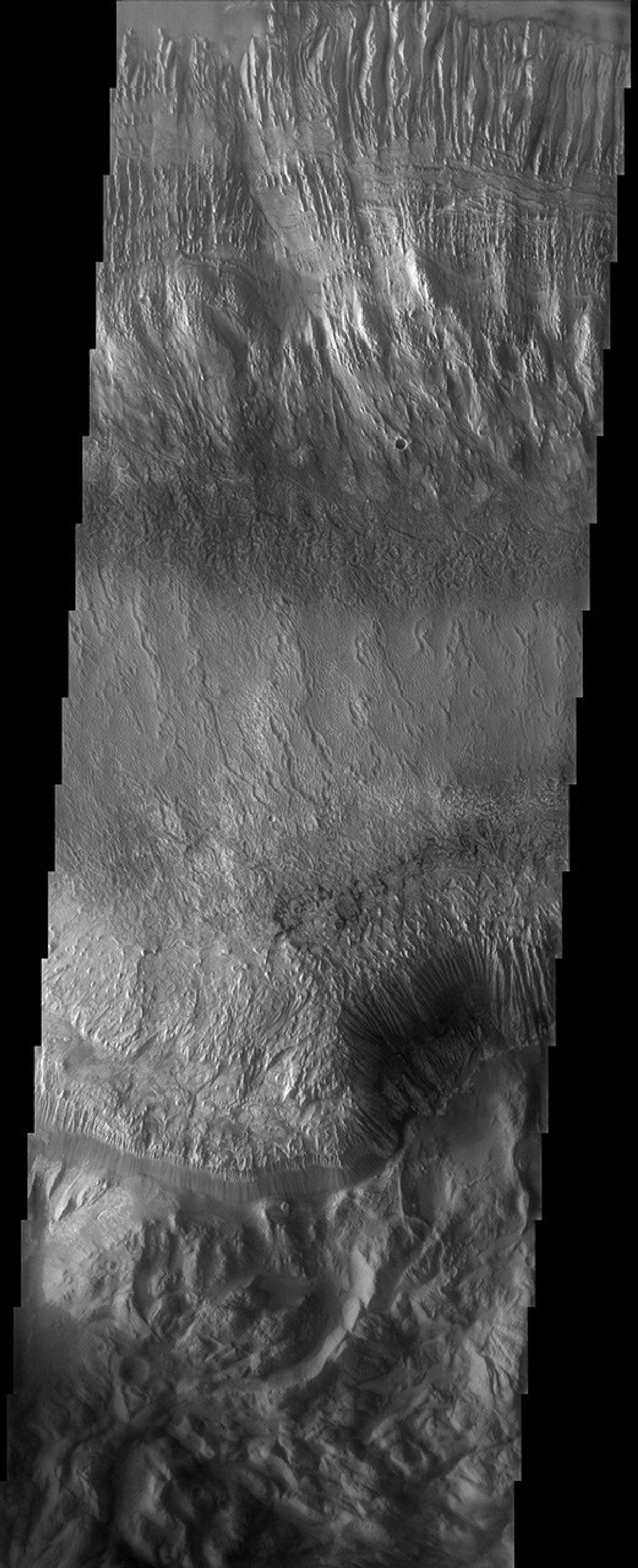 This image taken by NASA's 2001 Mars Odyssey shows Hebes Chasma, the northernmost canyon of Mars' vast Valles Marineris system.