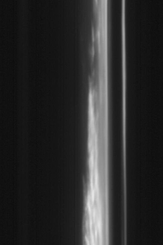 NASA's Mars Global Surveyor shows clouds and hazes above a sunward martian limb over the planet's northern plains.