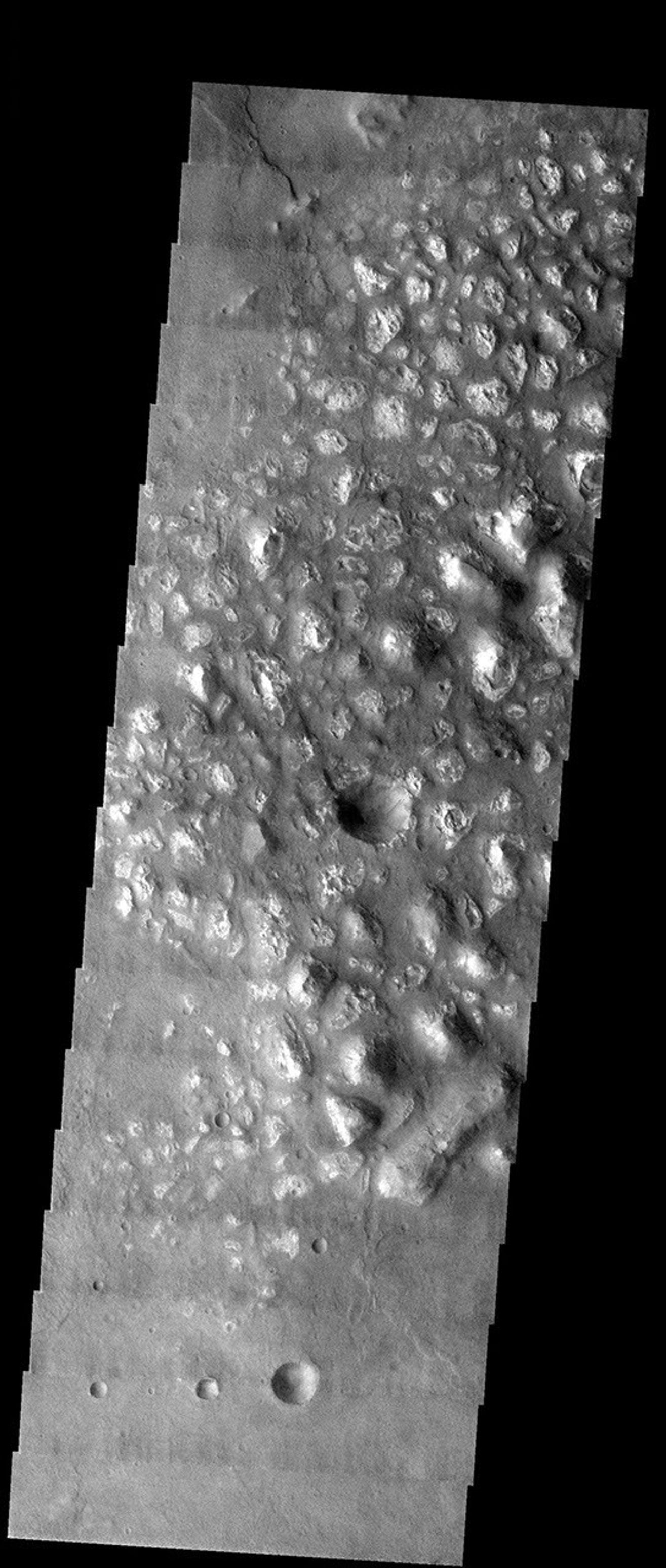 NASA's Mars Odyssey spacecraft captured this image in August 2003, showing knobby terrain is in the southern highlands on Mars.